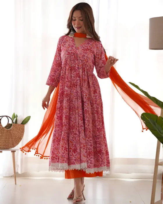 ORANGE BLOACK PRINTED ANRKALI SUIT SET . THIS 3 PIECE SET IS HAVING V NECK WITH 3/4 SLEEVES AND WITH THE DETAILING OF CROSHIA LACE ON HEM PAIRED WITH ORANGE COTTON PALAZZO ALONG WITH CHIFFON POTLIS DUPATTA. The colors seen in the image may vary from the a